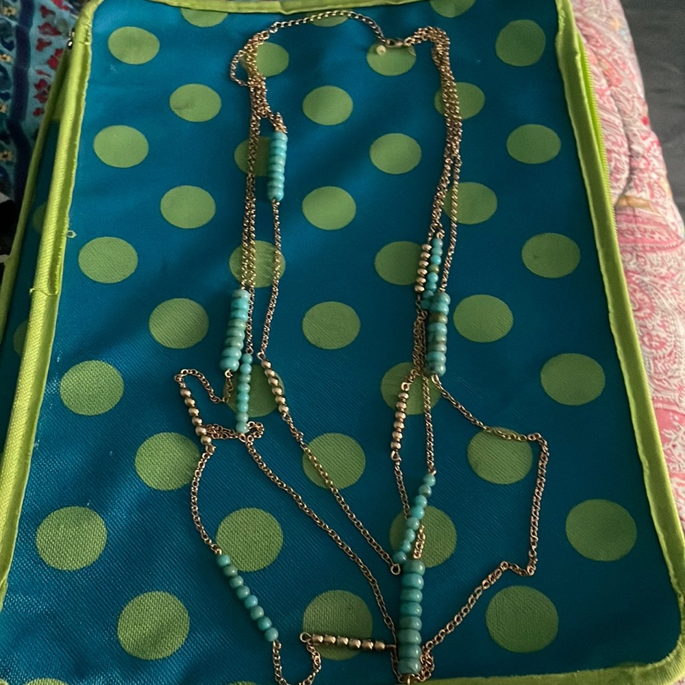 Avon golden mustang long necklace.